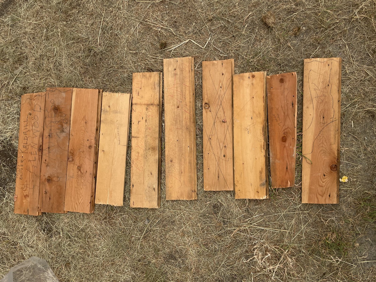 Wood boards laid out on grass